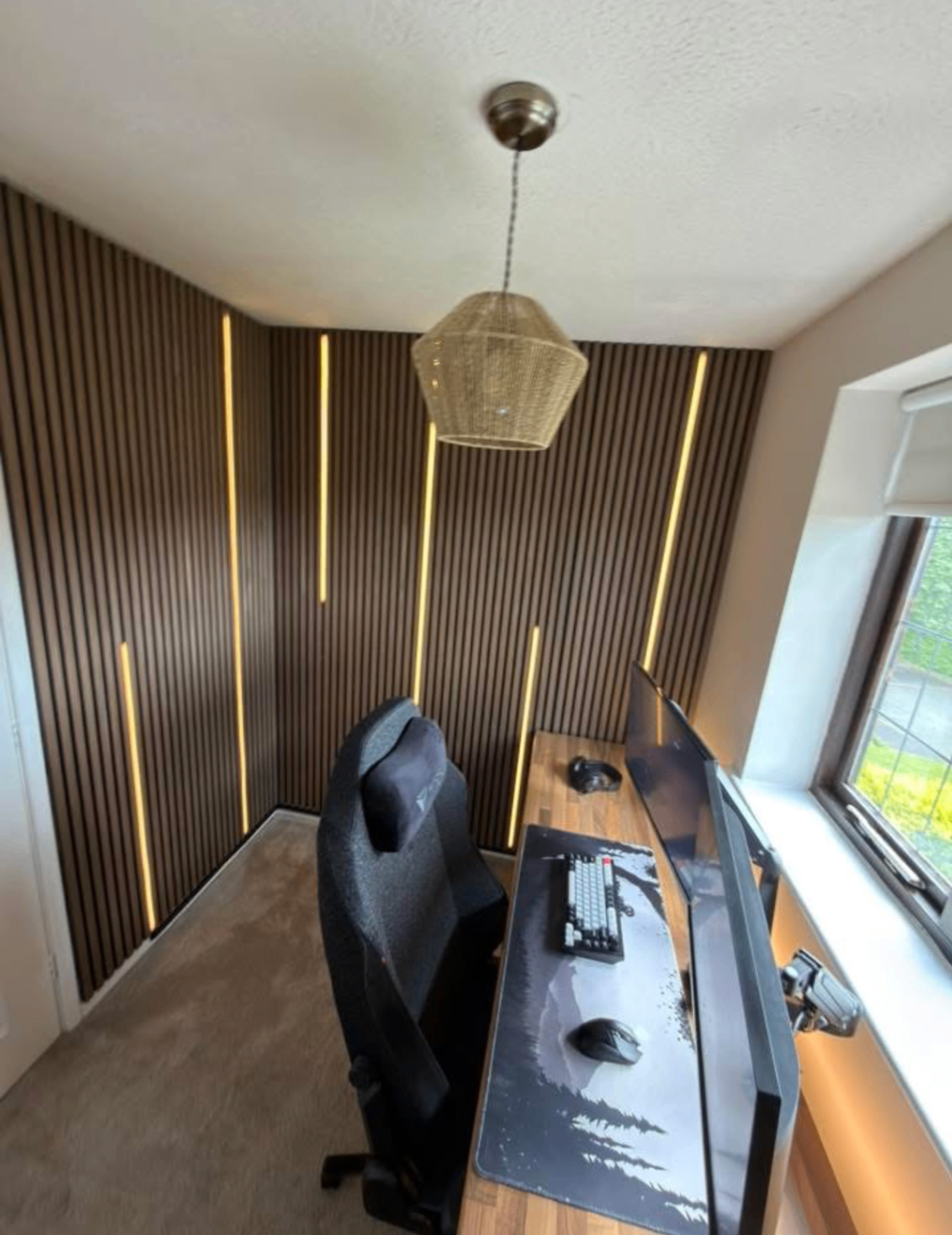 Finished home office installation with slat wall and lighting